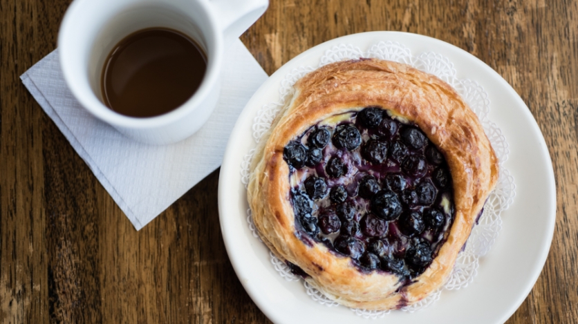 blueberry danish and a cup of coffee at Les Petites Pleasures in St. Augustine Florida
