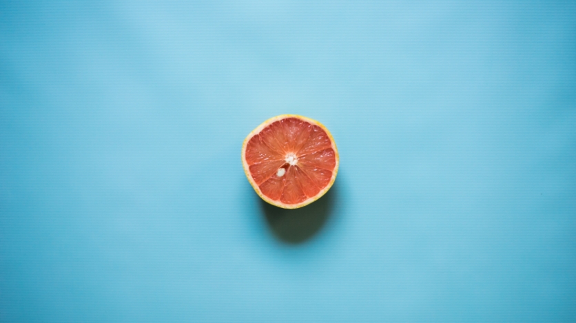 grapefruit on blue background