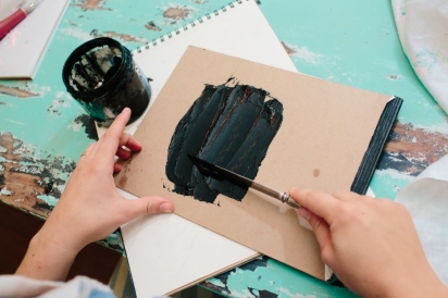 spread ink on a flat surface for a diy linoleum stamp