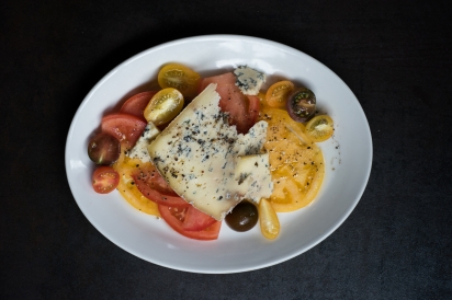 Blue Cheese and heirloom tomatoes on a plate