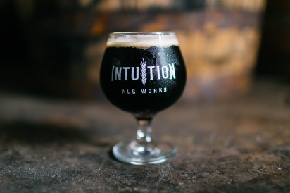 Glass of dark beer from Intuition Ale Works