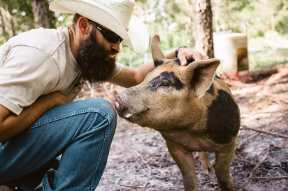 David Griffis of cognito farms and one of his hogs in starke florida