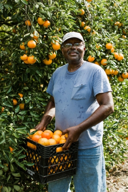Cecil Nelson holding an orange crate