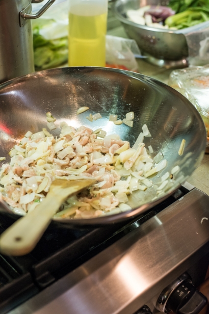 Chicken and onions frying in wok