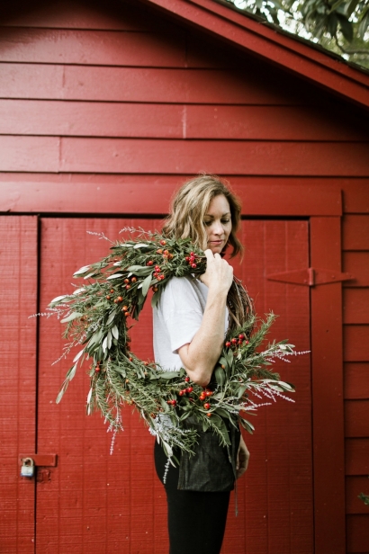 Becky Cardenas holding wreath.