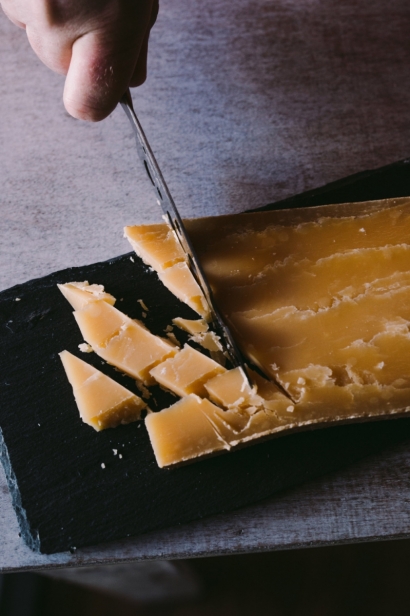 Cutting cheddar cheese