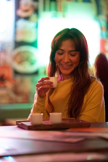 woman sipping sake at hawkers asian street food in jacksonville