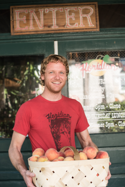 Jeff McNally of the Floridian in St. Augustine accepts a local delivery of peaches
