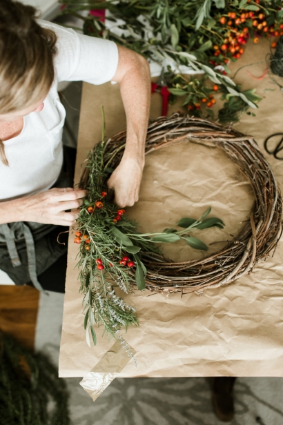 Making a wreath with foraged plants.