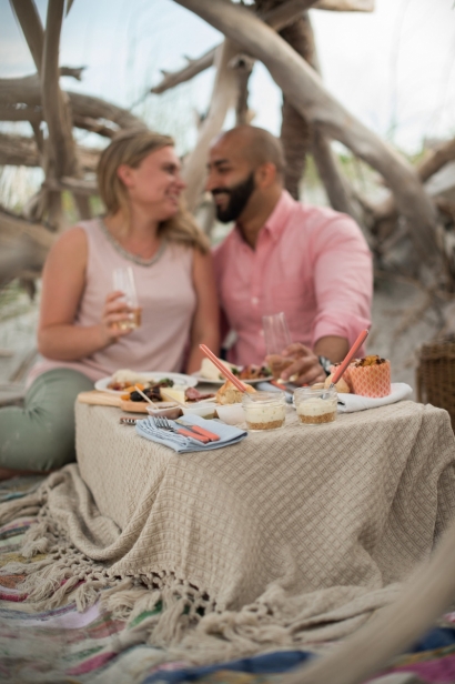 couple picnic dining at the beach
