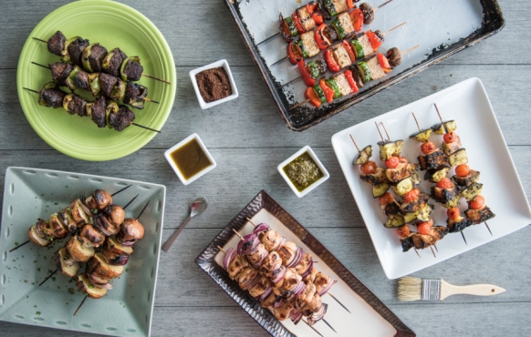 assorted grilled meat and vegetables on skewers