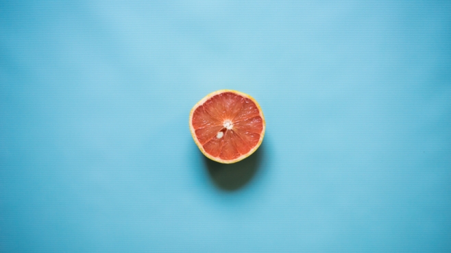 grapefruit on blue background