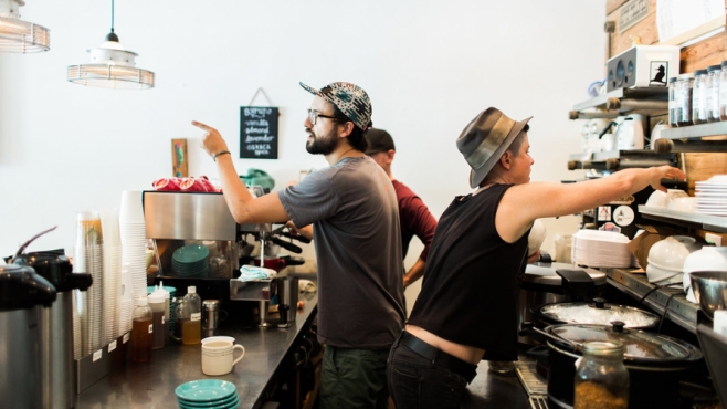 baristas at a coffee machine at Southern Roots Filling station