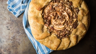 Caramel Apple Pecan Galette on black background with blue towel from My Grandmothers Pie in Jacksonville Florida 