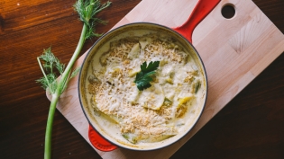 fennel gratin in pan with fennel frond